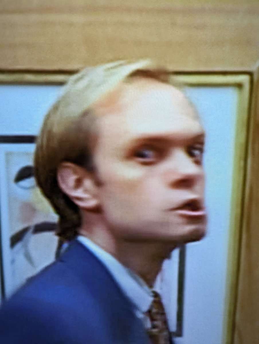 Niles Crane turning to camera very peeved